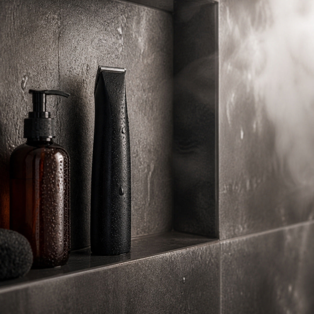 Body trimmer on a shower shelf