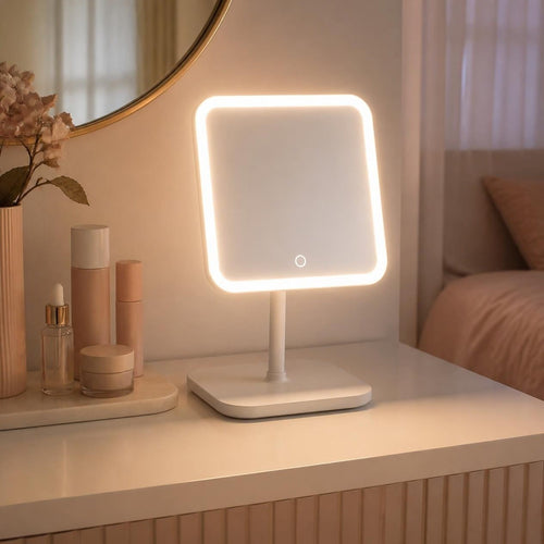 Lit vanity mirror on a dressing table